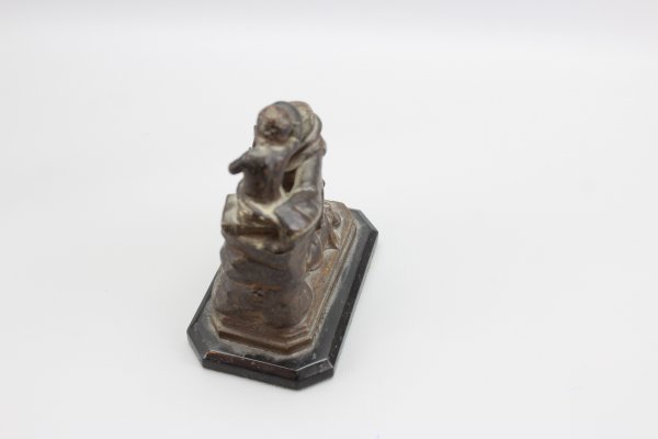 Ecclesiastical sculpture monk with child