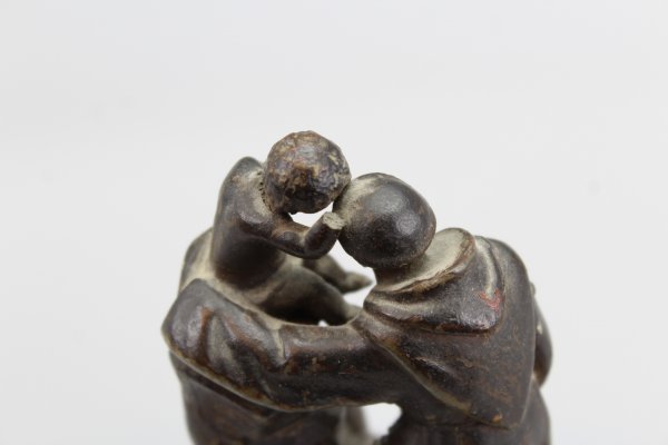 Ecclesiastical sculpture monk with child