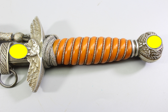 Excellent Luftwaffe officer’s dagger with an orange grip, made by SMF, Solingen. Includes acceptance stamp and hangers.