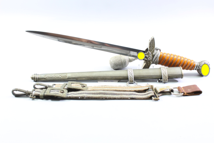 Excellent Luftwaffe officer’s dagger with an orange grip, made by SMF, Solingen. Includes acceptance stamp and hangers.