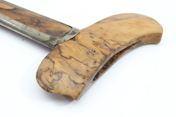 Java kris dagger with a straight flamed meteor iron blade and carved wooden handle.