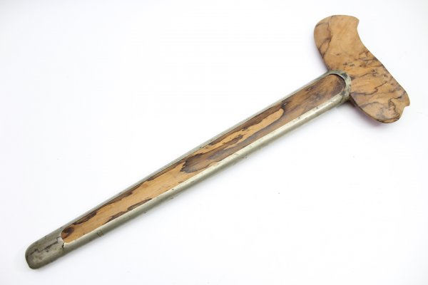 Java kris dagger with a straight flamed meteor iron blade and carved wooden handle.