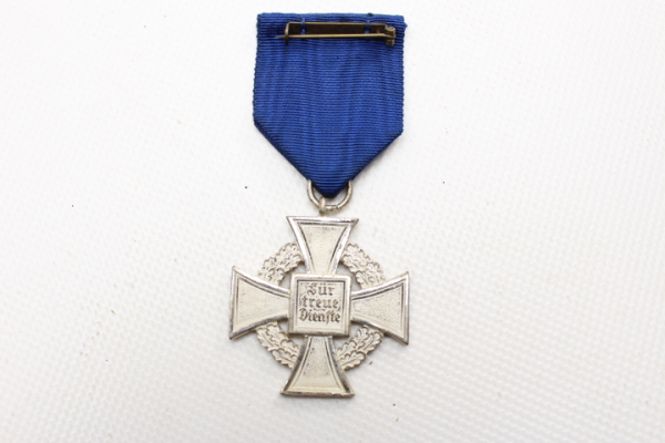 Cross medal Treuedienstabzeichen in silver on a ribbon for 25 years of loyal service, uncleaned