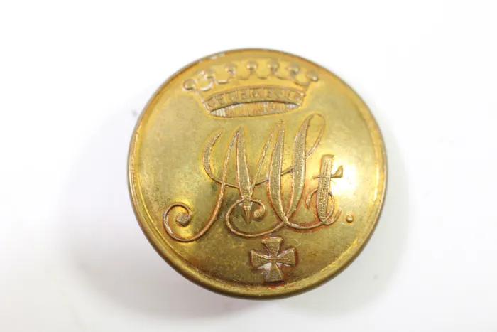 Metal buttons from a German uniform tailor, head uniform