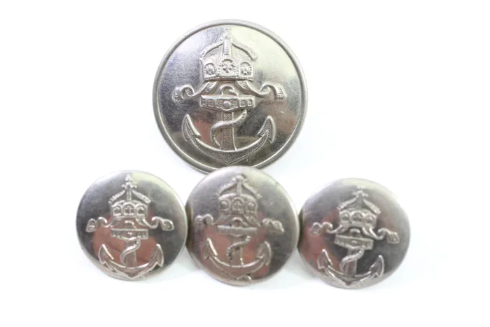 Metal buttons from a German uniform tailor, head uniform