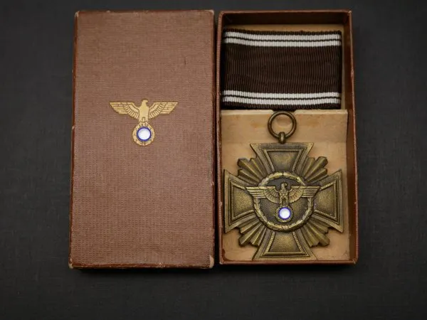 NSDAP service award in bronze, zinc bronzed on ribbon in the brown award box