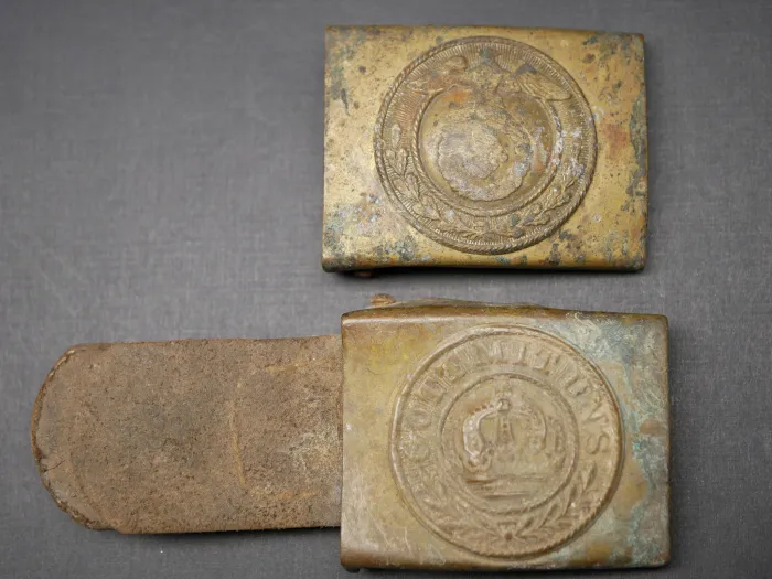 2x belt buckles, found in the ground - SA denazified + Prussia with leather tongue