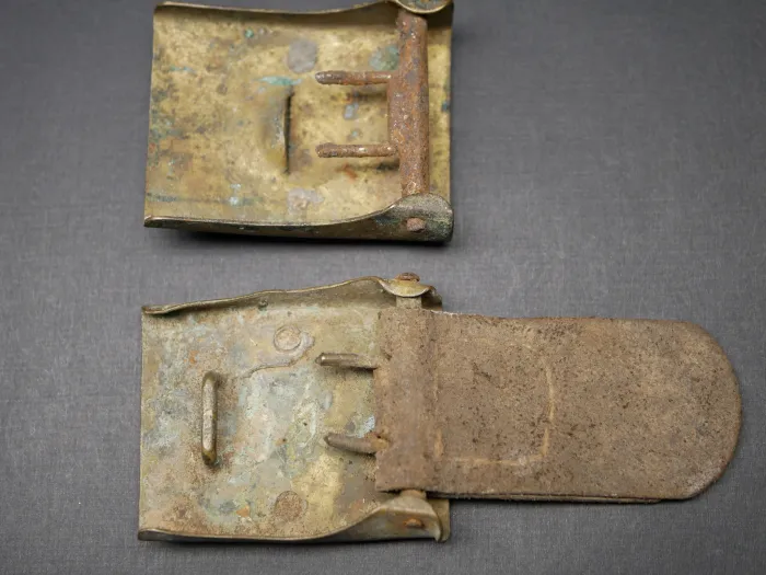 2x belt buckles, found in the ground - SA denazified + Prussia with leather tongue
