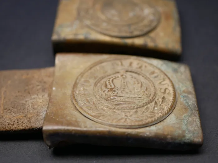 2x belt buckles, found in the ground - SA denazified + Prussia with leather tongue