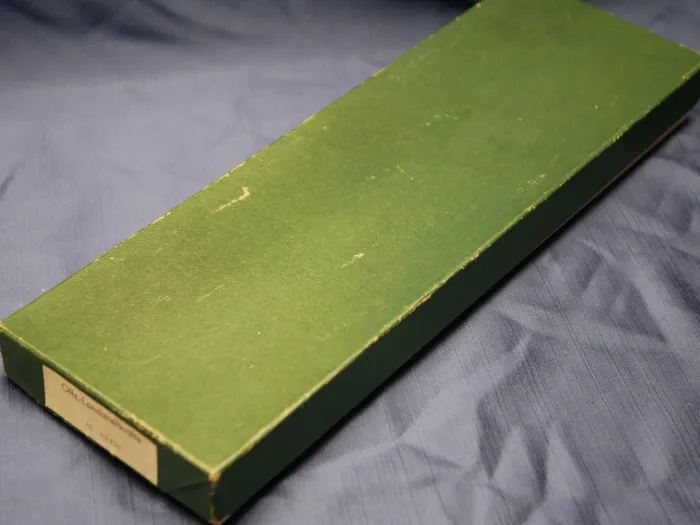 NVA officer's dagger of the land forces with hanger + parade sash + matching numbered box + guarantee certificate from 1984