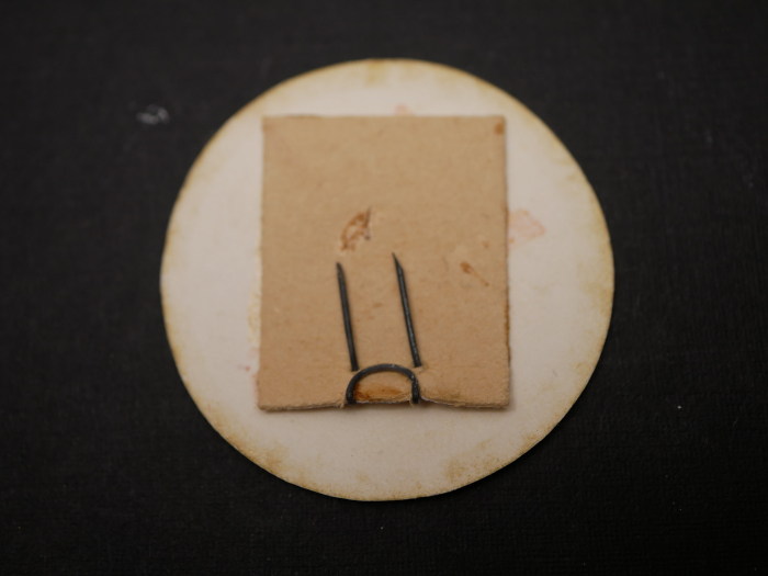 Badge – V with swastika, cardboard