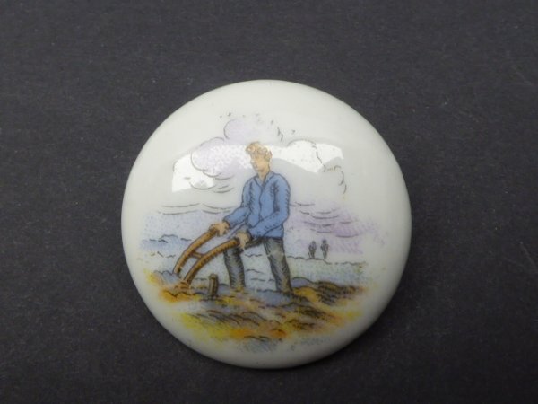 Porcelain badge pawn with plow
