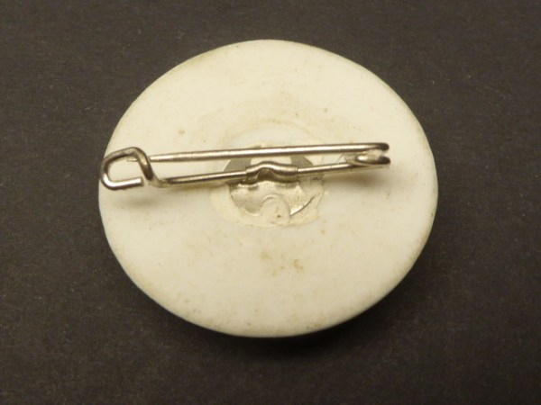 Porcelain badge pawn with plow