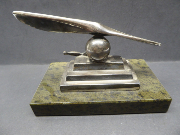 Farewell present - propeller with on-board dagger on base