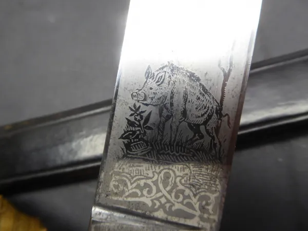 Heavy stag hunter with triple blade etching and Saxon portepee