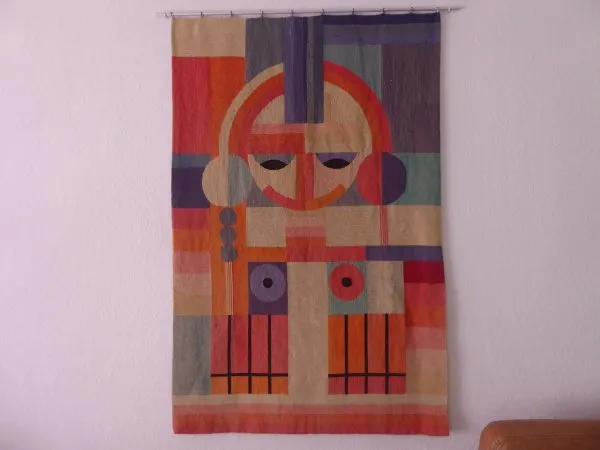 Bauhaus wall hanging / tapestry - geometrically arranged female body. (face + braids + breasts). Environment Grete Reichard