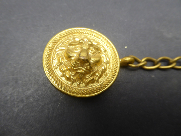 Lion's head - clasp for the cape, the so-called "Spaniard" made of non-ferrous metal