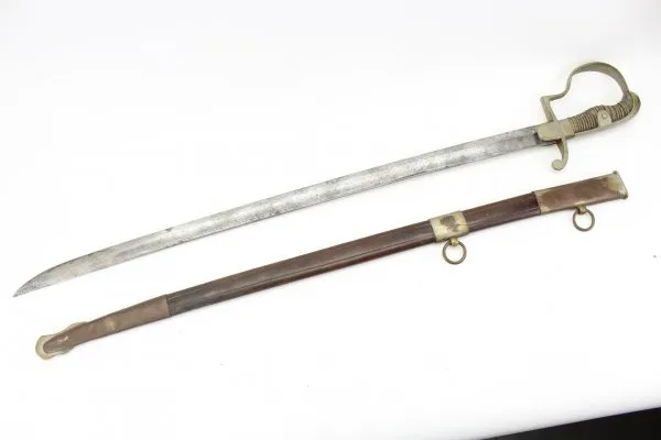 Officer's saber with blade etching in leather sheath.