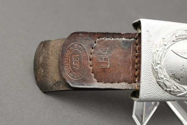 WW2 Luftwaffe belt lock 1. Form aluminum. Embossed with leather strap at Brieg Air Base