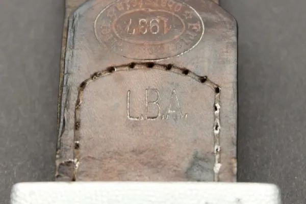 WW2 Luftwaffe belt lock 1. Form aluminum. Embossed with leather strap at Brieg Air Base