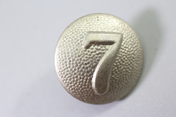 Original metal uniform button, also known as a livery button