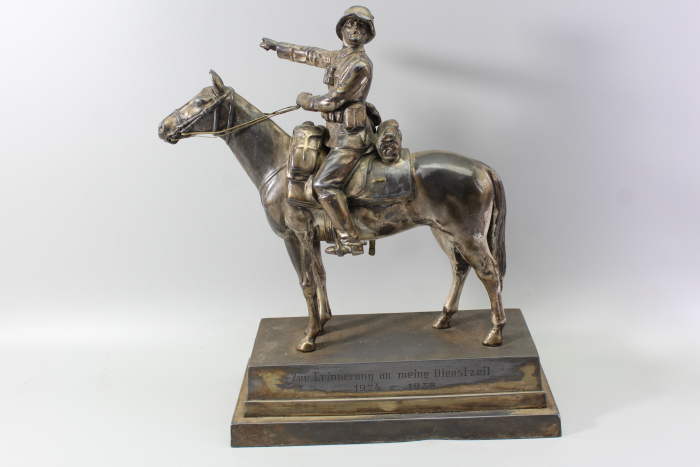 Original sculpture of a mounted German Wehrmacht cavalry soldier with steel helmet and equipment; inscribed "In memory of my service 1924–1938"
