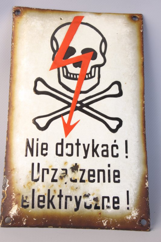 Old enamel sign indicating high voltage on the fence, used condition