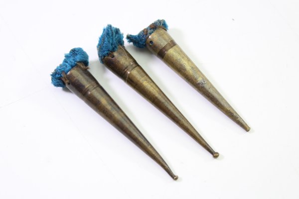 Brass end caps for a tassel ribbon for fastening uniforms