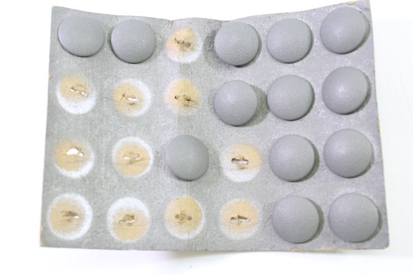 13 field gray buttons for uniforms, shoulder boards, 16 mm in diameter each, on cardboard.