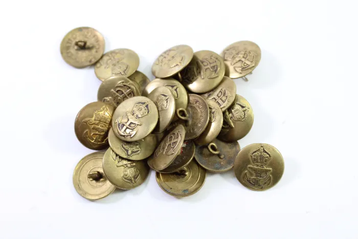 Metal buttons from a German uniform tailor, head uniform