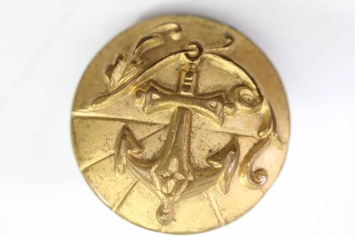 7 metal buttons for a naval dress uniform, salvaged from an old uniform tailor