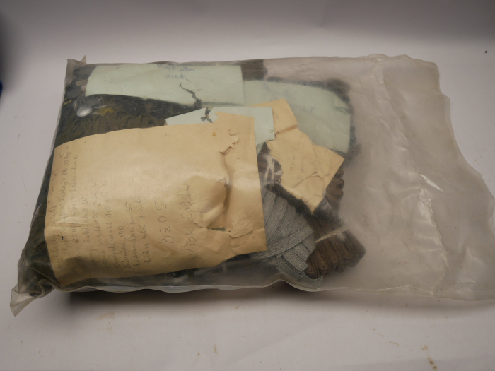 Original sealed bag containing NVA insignia – shoulder boards, buttons, rank stars, cords, etc.