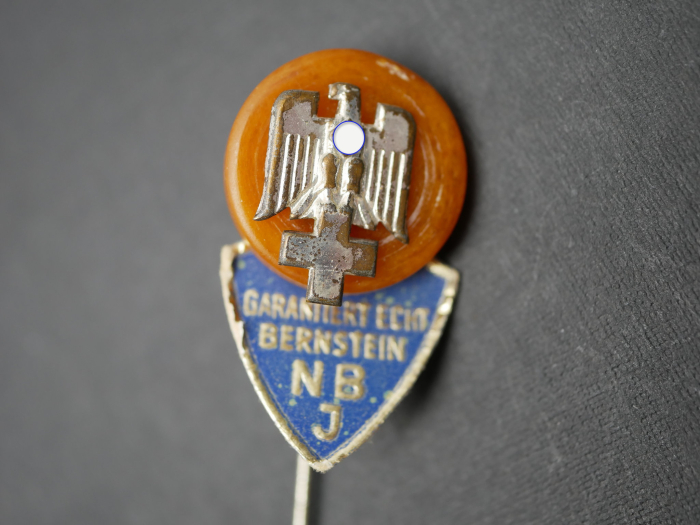 Amber badge – DRK (German Red Cross) with "Guaranteed genuine amber NBJ" label.