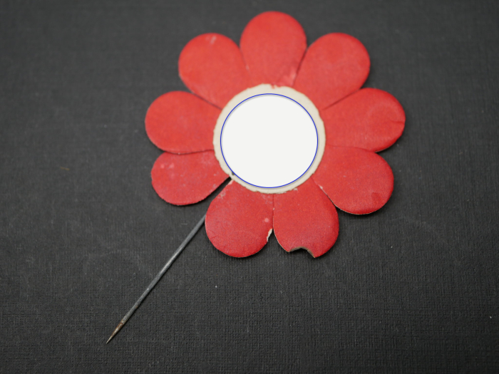Paper badge – flower with swastika – Labor Day, with slip of paper