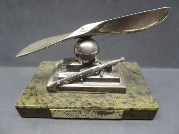 Farewell present - propeller with on-board dagger on base