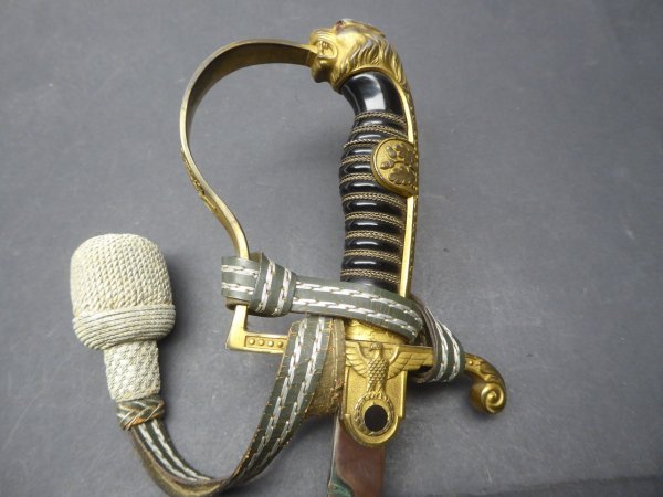 Early lion's head saber with portepee made by Anton Wingen Solingen