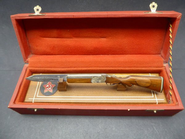 Gift gun-shaped letter opener with standee in a case