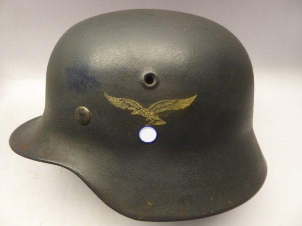 Stahlhelm M40 Luftwaffe Field Division with camouflage paint and a badge