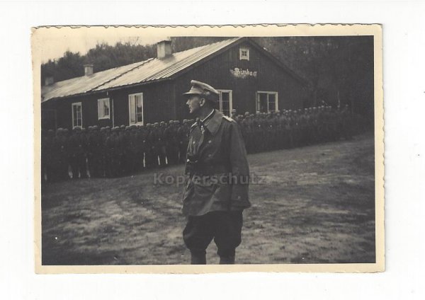 hoto knight cross holder Dietl in front of an SS company